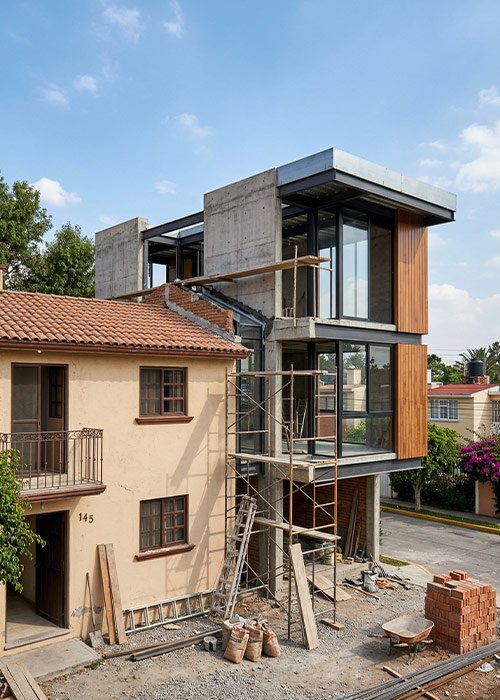 Ampliación de vivienda con nueva construcción integrada